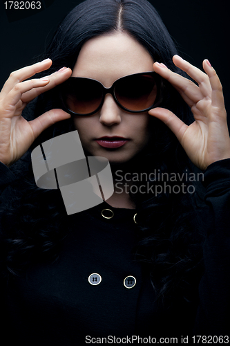 Image of brunette wearing sunglasses