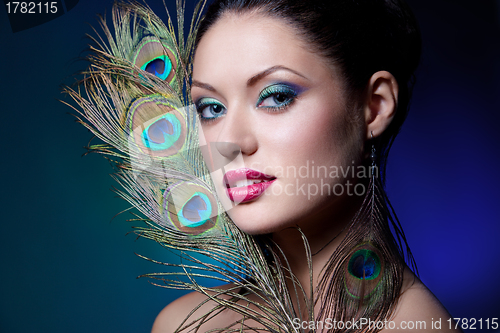 Image of young brunette with creative makeup