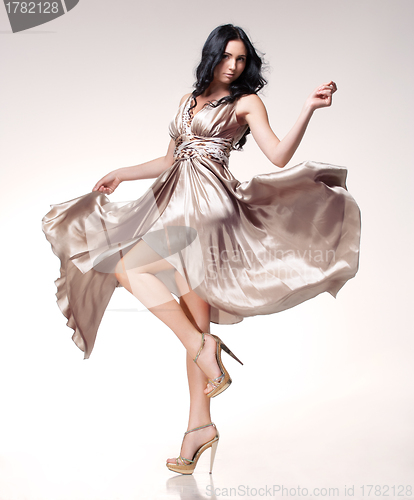 Image of brunette in waving dress