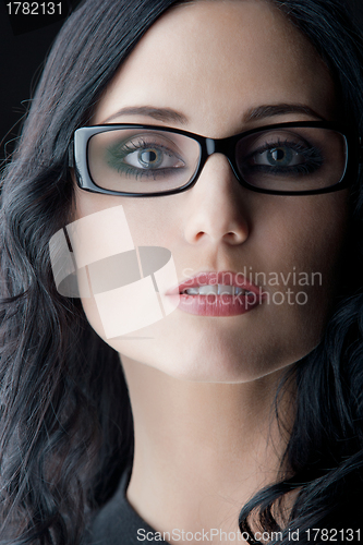 Image of brunette wearing glasses
