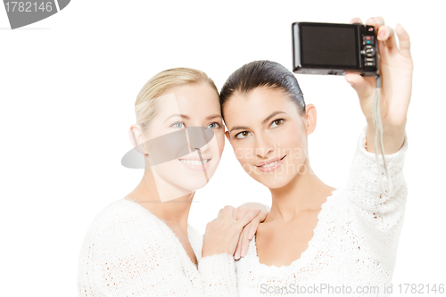 Image of two young women taking pictures