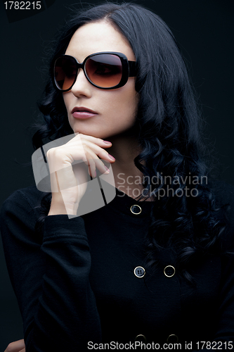 Image of brunette wearing sunglasses