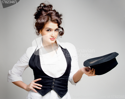 Image of brunette with hat