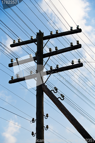 Image of old wooden electric post