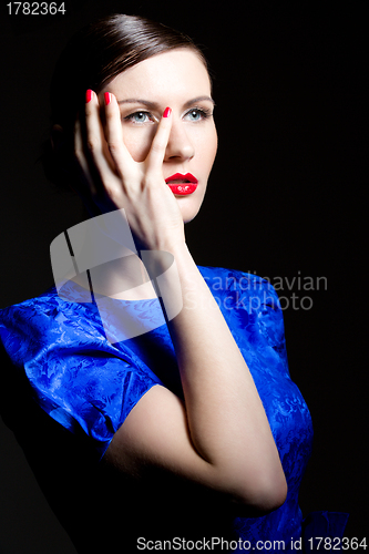 Image of young woman in blue dress