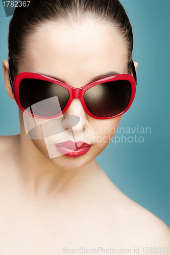 Image of young woman wearing sunglasses