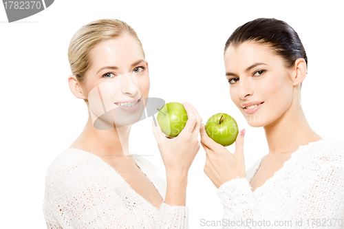 Image of two smiling women with apples