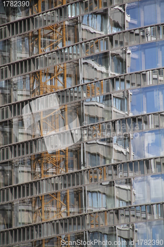 Image of Construction reflected in a house
