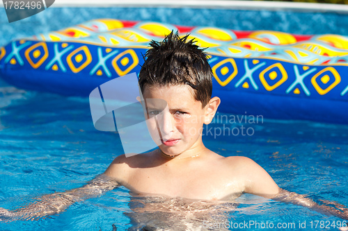 Image of Boy in swimming pool 