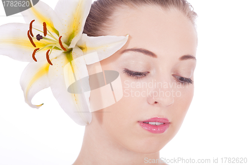 Image of young beautiful woman portrait with white flower