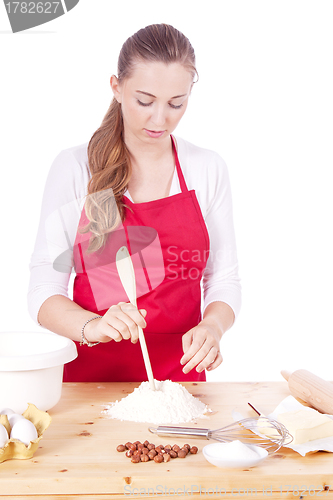 Image of beautiful woman is baking cookies for christmas