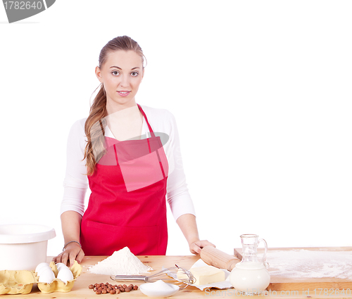 Image of beautiful woman is baking cookies for christmas