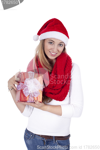 Image of young smiling girl with red hat and present christmas