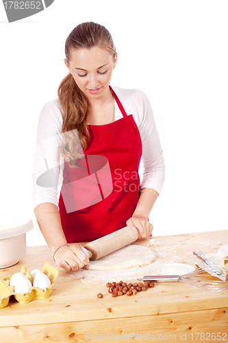 Image of beautiful woman is baking cookies for christmas