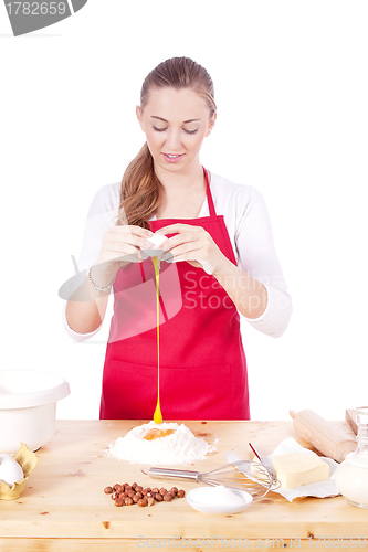 Image of beautiful woman is baking cookies for christmas