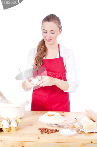 Image of beautiful woman is baking cookies for christmas