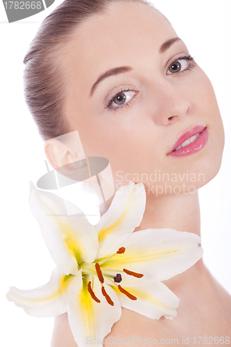 Image of young beautiful woman portrait with white flower