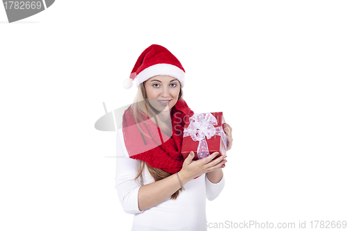 Image of young smiling girl with red hat and present christmas