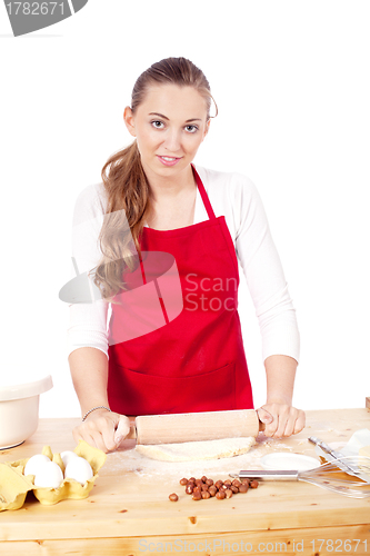 Image of beautiful woman is baking cookies for christmas