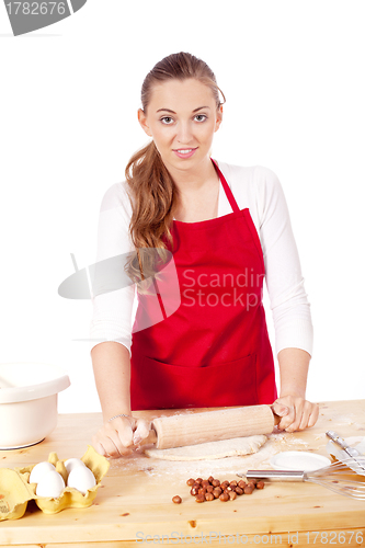 Image of beautiful woman is baking cookies for christmas