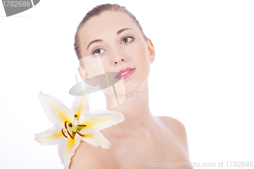 Image of young beautiful woman portrait with white flower