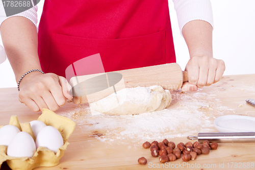 Image of beautiful woman is baking cookies for christmas