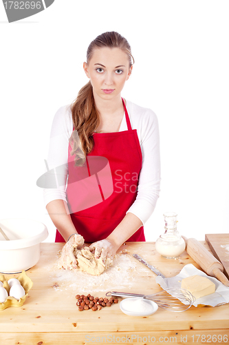 Image of beautiful woman is baking cookies for christmas