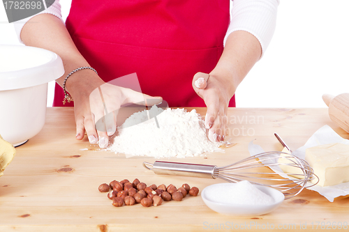 Image of beautiful woman is baking cookies for christmas