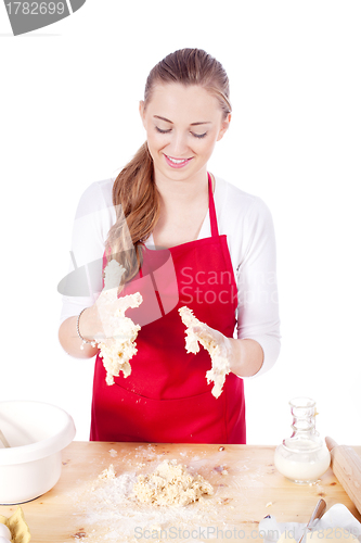 Image of beautiful woman is baking cookies for christmas