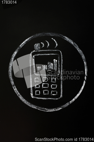 Image of Chalk drawing of mobile phone symbol on blackboard background