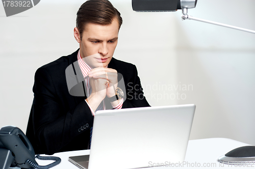 Image of Serious businessman concentrating