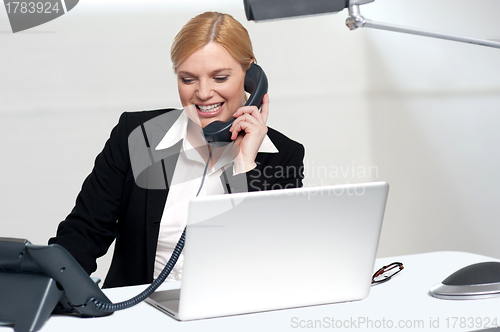 Image of Female secretary communicating with her boss