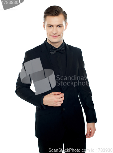 Image of Smiling young man in party wear attire