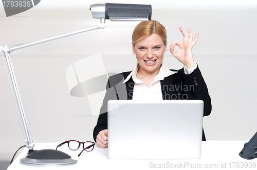 Image of Corporate lady showing excellent gesture