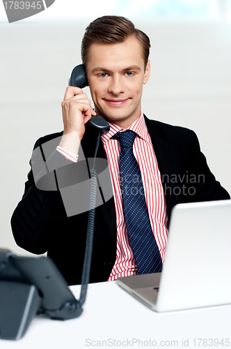 Image of Male executive on a business call