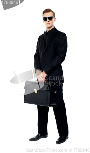 Image of Full length portrait of handsome male with briefcase