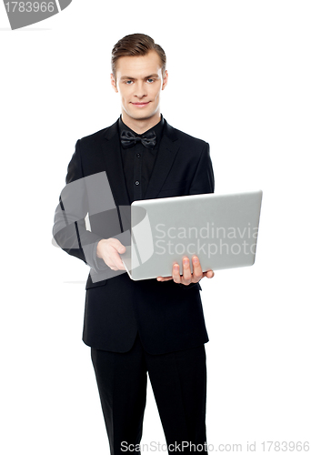 Image of Casual young man with laptop