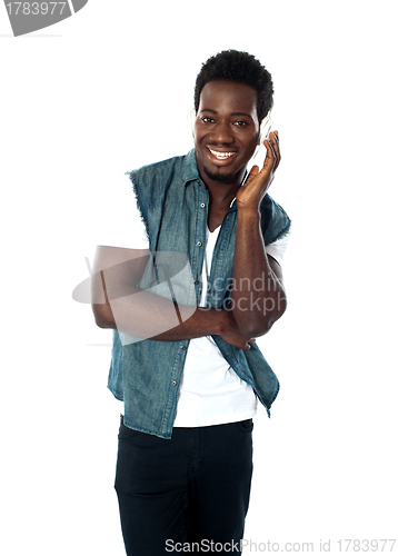 Image of African teen boy enjoying music