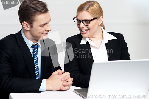 Image of Businessman discussing deal with secretary