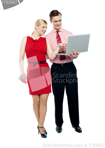 Image of Female secretary pointing into laptop