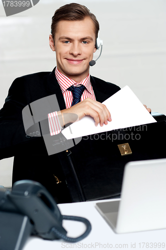 Image of Customer care person arranging office documents