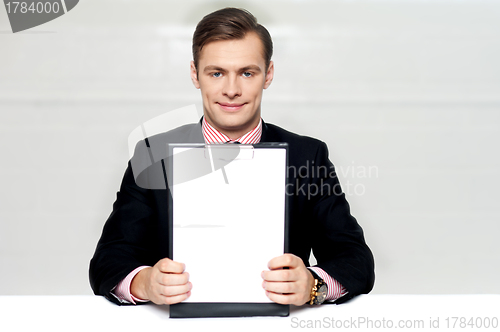 Image of Corporate man showing blank clipboard