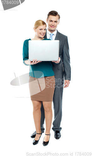 Image of Smiling portrait of young business team