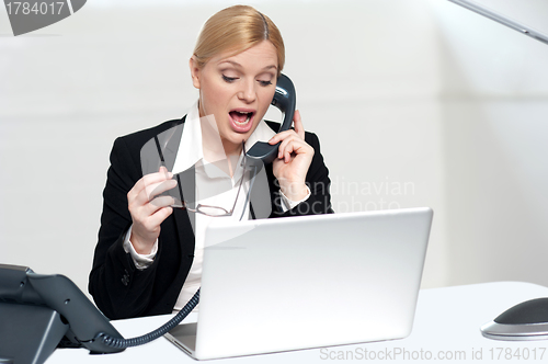 Image of Woman trying to convince client over the phone