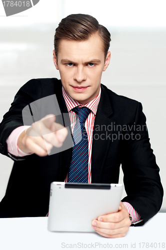 Image of Tech savvy corporate man pointing at you