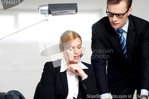 Image of Female secretary explaining to boss