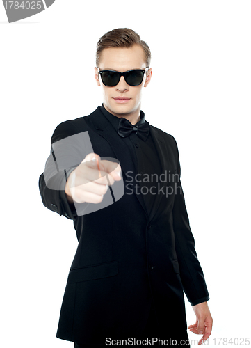 Image of Handsome man indicating towards you