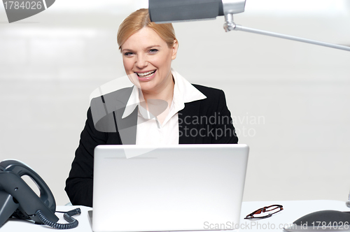 Image of Pretty businesswoman at work