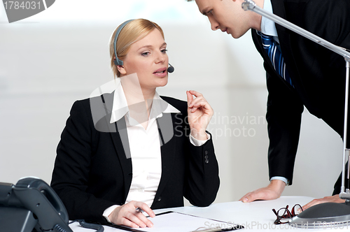 Image of Female executive discussing business issue