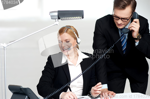 Image of Male executive attending clients call